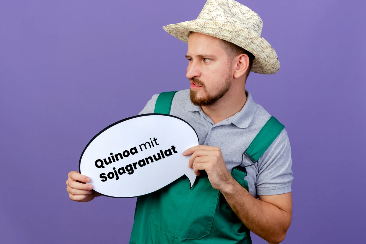 verwirrter Bauer mit Schild "Quinoa mit Sojagranulat"